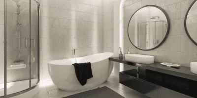Bagno ristrutturato moderno con doccia in vetro, vasca freestanding e rivestimenti effetto pietra